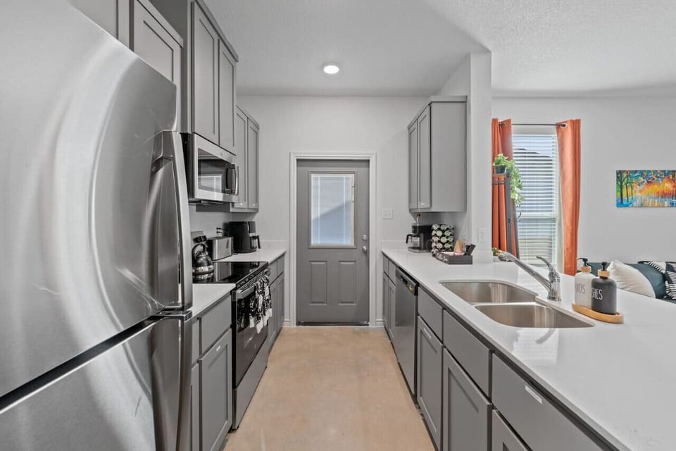 Enjoy a clean, fully equipped kitchen with ample counter space—perfect for cooking, meal prep, and longer stays.