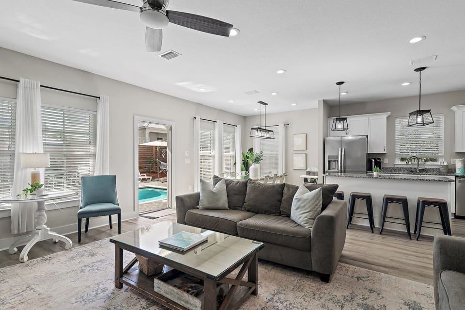 Living room opens directly to the pool area.