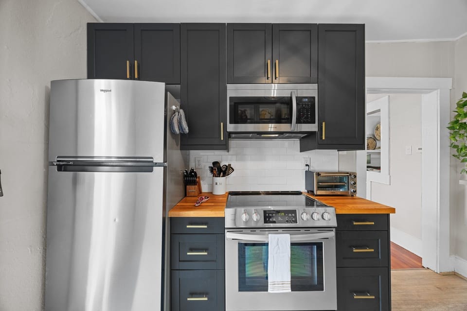 Kitchen is outfitted with an electric range