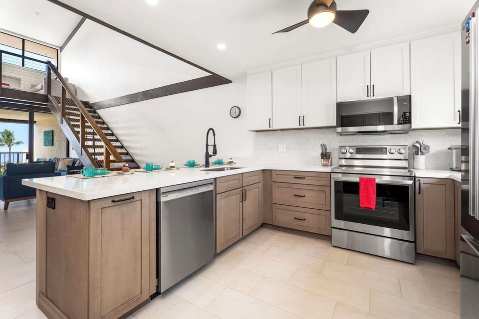Kitchen equipped with dishwasher and bar seating