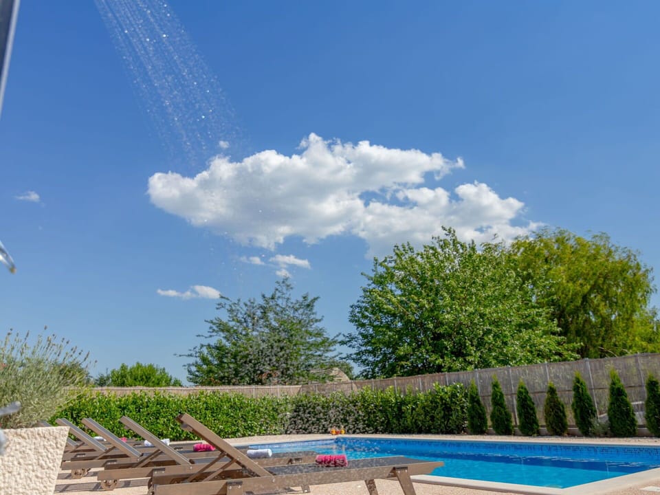Sky, Cloud, Water, Plant, Swimming Pool, Shade, Outdoor Furniture, Natural Landscape, Grass, Leisure