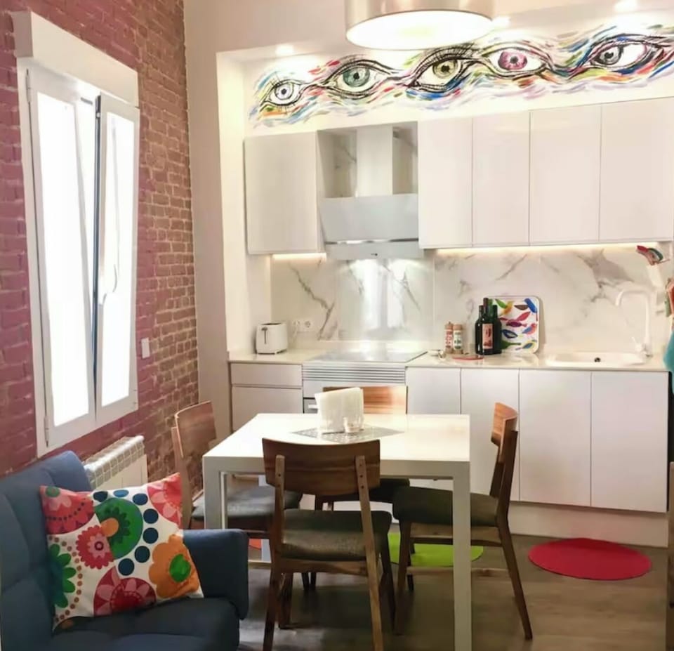 A cozy kitchen dining living area.