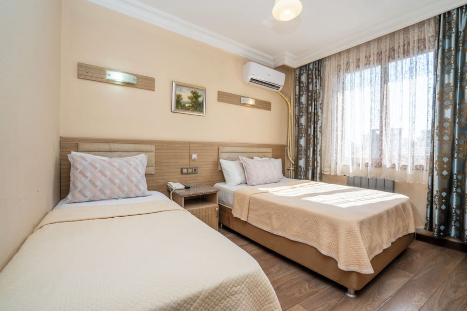 Standard Double or Twin Room, City View | Bathroom | Shower, hair dryer, slippers, towels