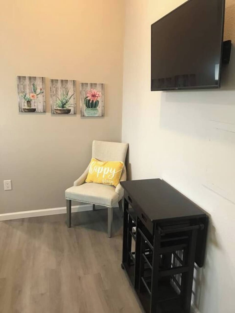 Wall mounted smart tv with all the apps.  A small dining table with and extend leaf.  Compact to create more space when not being used. 