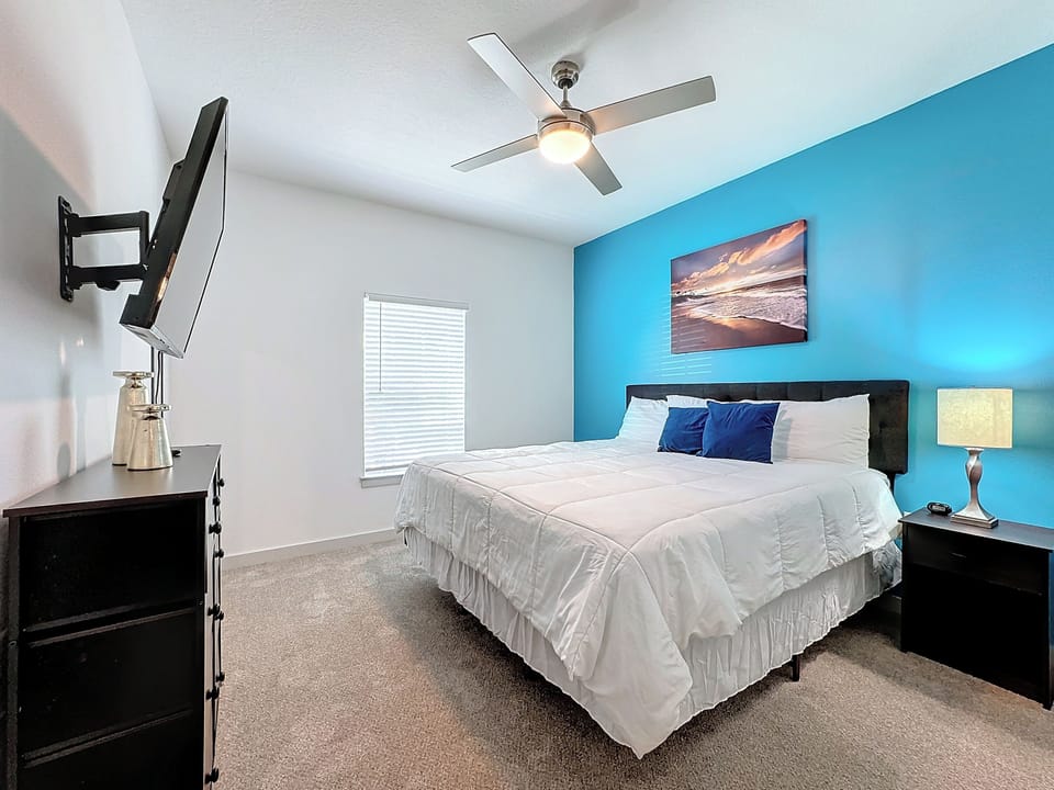 Unwind in Style: Retreat to our expansive bedroom featuring a king-size bed.