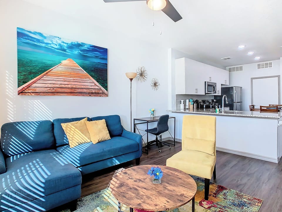 Relax and unwind in this stylish and cozy living room with 50 inch TV and futon.