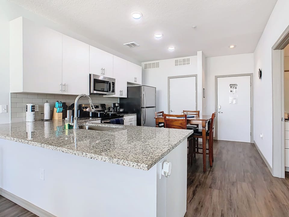 Modern and sleek kitchen, perfect for culinary adventures, during your stay.