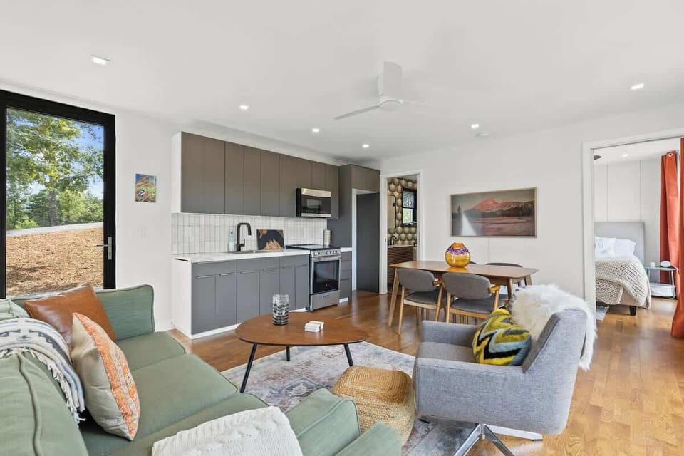 Seamless flow between living, dining, and kitchen spaces.