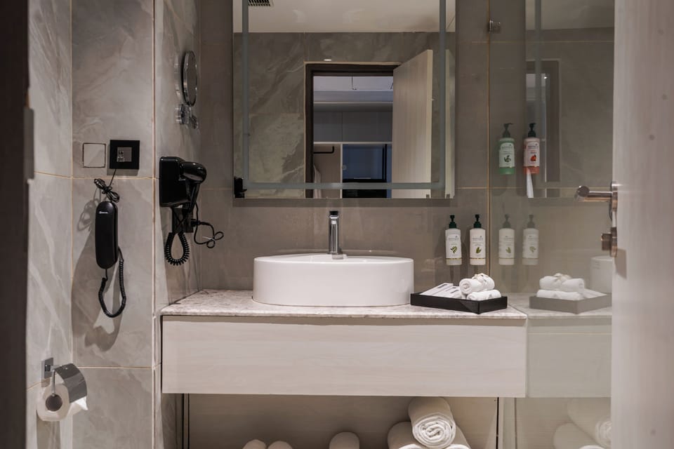 Superior Room, Courtyard View | Bathroom | Shower, hair dryer, towels, soap