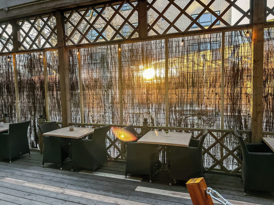 Warm sunlight, rustic wood, and peaceful vibes—this is where you want to be as the sun sets.