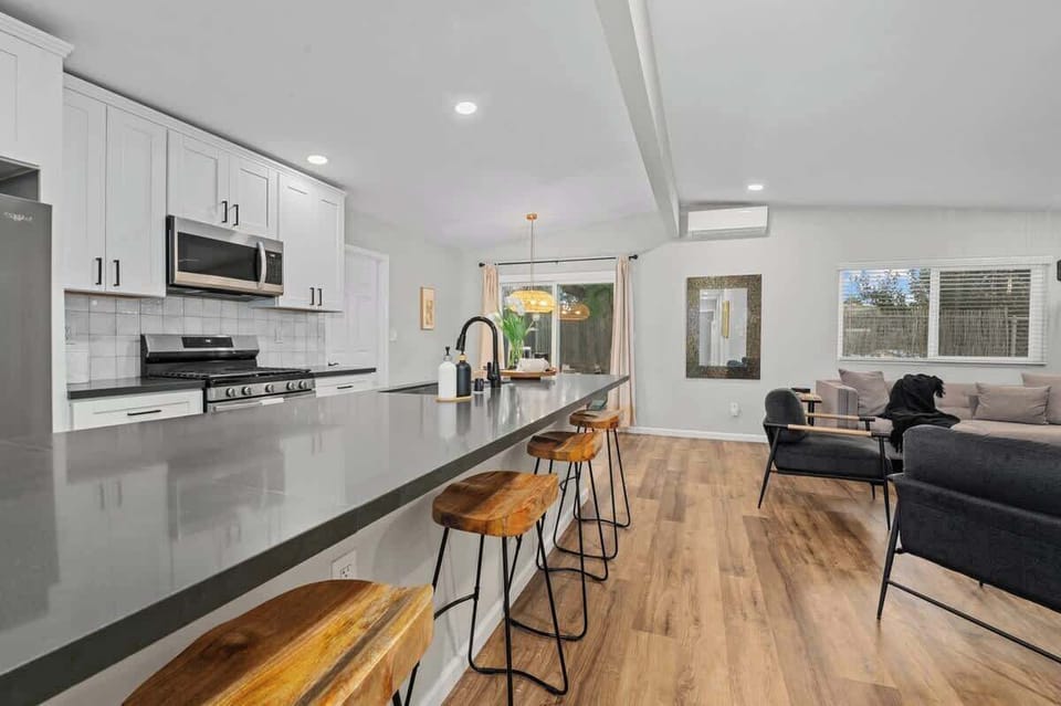 a welcoming space dedicated to meals and gatherings. It typically features a central dining table surrounded by chairs, with enough seating to accommodate family members.