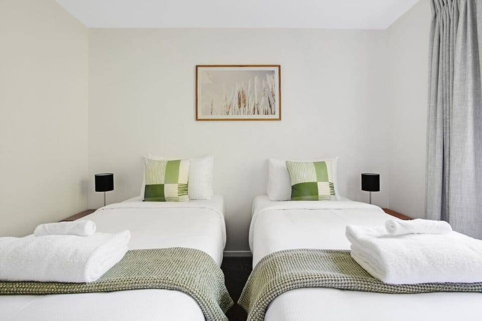 There are crisp white sheets and a colourful throws on the beds.