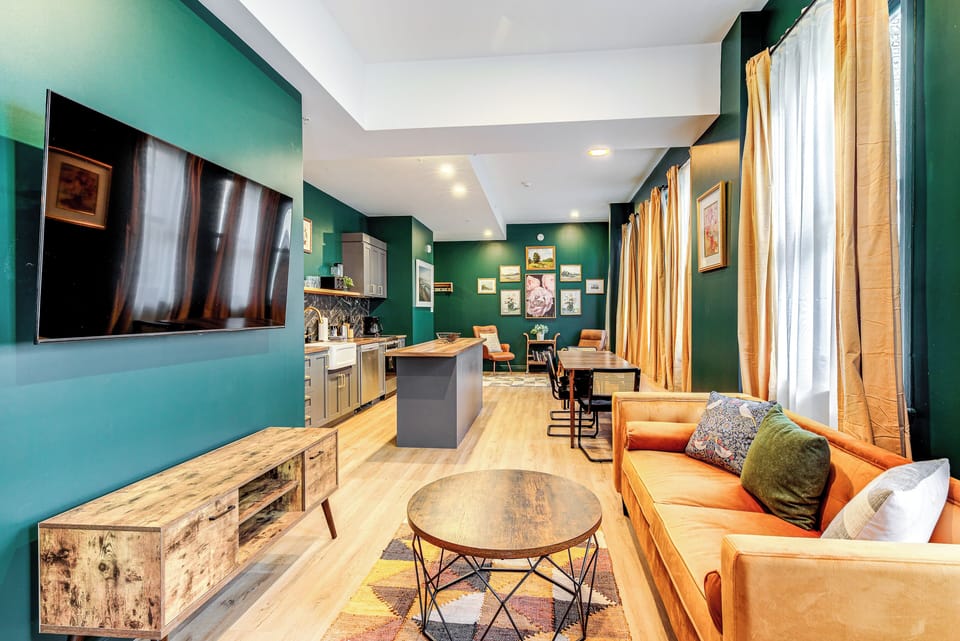 Signature Apartment | Living area | 55-inch flat-screen TV with cable channels, TV
