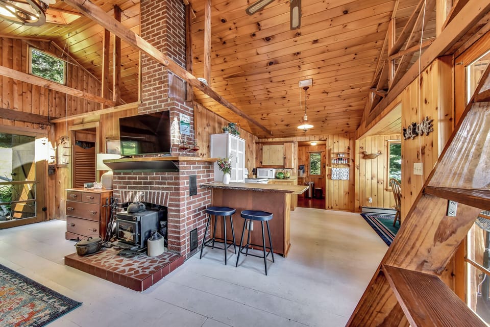 Open living room & kitchen with bar seating.