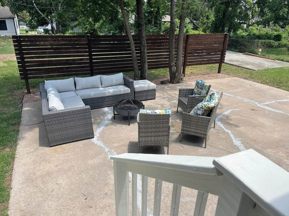 Outside sitting area with a fire pit and grill available