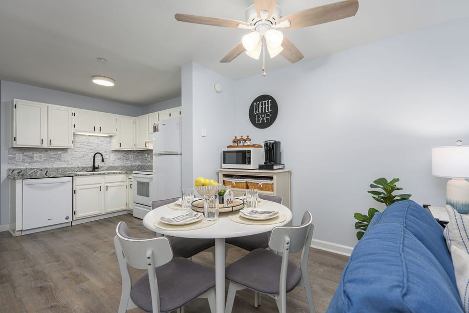 Enjoy a fresh, coastal kitchen with seating for 4 and a dedicated coffee bar stocked with coffee, tea, and everything you need for a perfect morning.