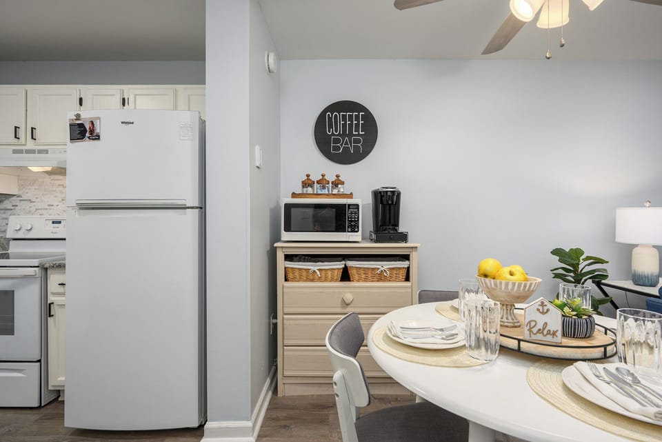 Thoughtfully designed kitchen and dining space for 4, complete with a cozy coffee station stocked with coffee, tea, and all your morning essentials.