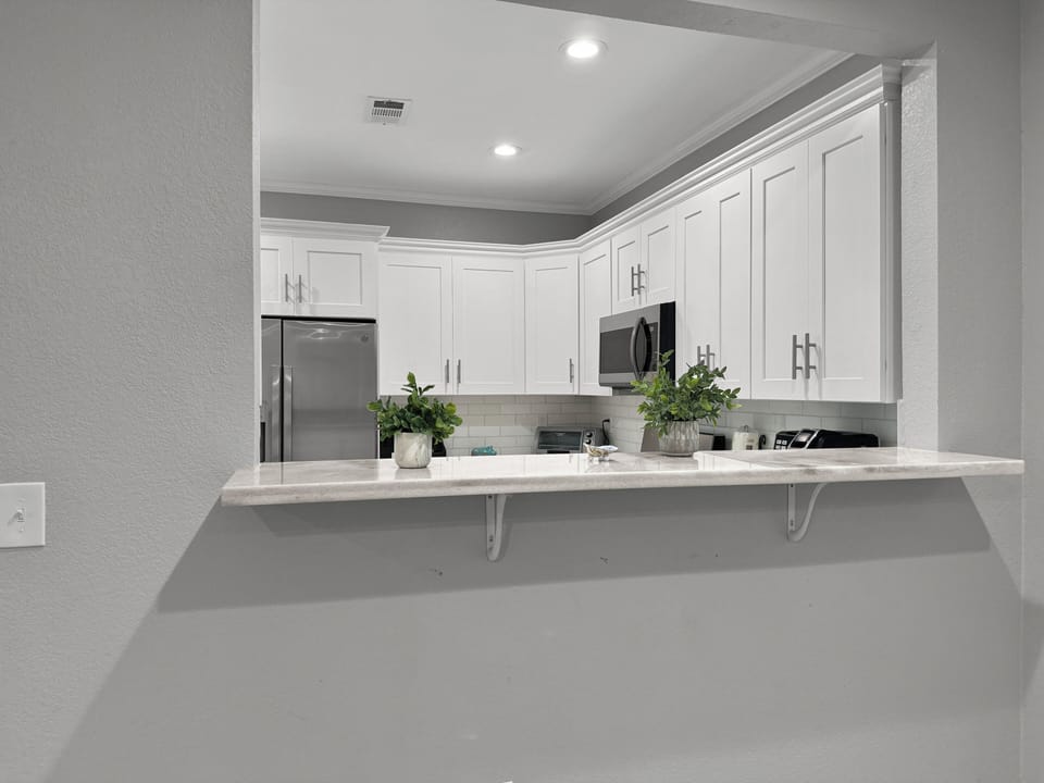 kitchen looking over bar from dining area