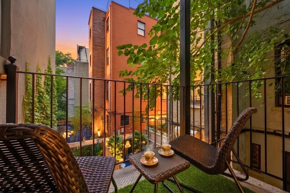 Escape the New York hustle on a serene patio, offering stunning views and the perfect spot to unwind