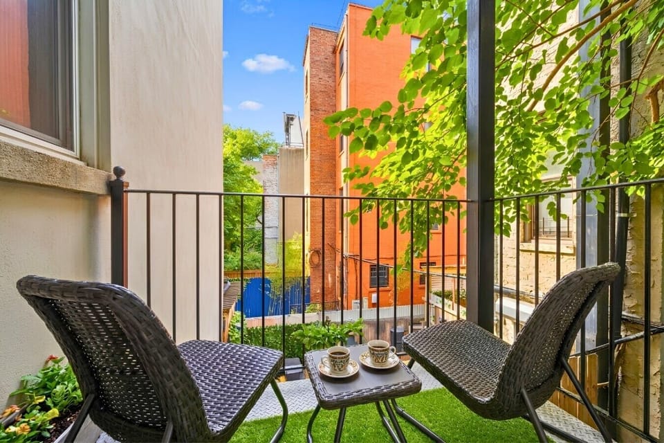 Step out to the balcony for a breath of fresh air and a glimpse of urban life!