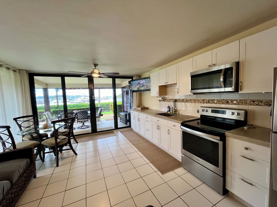 Patio doors lead to outdoor dining space and large patio with stunning views!