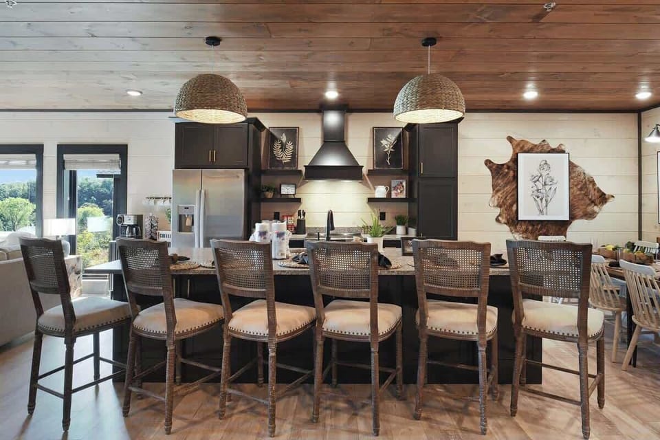 Rustic kitchen island with seating for six and woven pendant lighting.