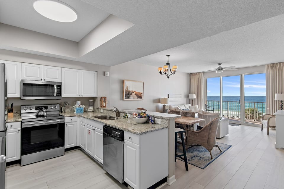 Kitchen has GULF VIEWS, granite countertops, stainless appliances - fully stocked with more than the basics (coffee/tea bar, oils/salt and pepper, Tupperware, plenty of pots/pans/cookware)