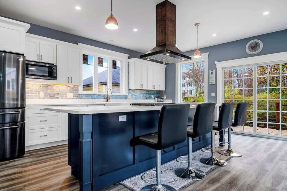 Award-winning gourmet chef’s kitchen with top-tier appliances and elegant finishes—perfect for cooking, entertaining, or simply enjoying breakfast in luxury. Gaze out over floor-to-ceiling windows, a striking linear fireplace, + your private garden.