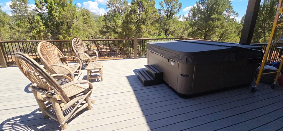 Private jacuzzi on spacious outdoor deck.