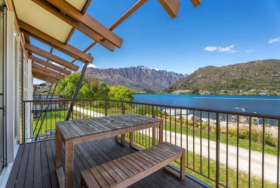 

Private balcony with outdoor dining, overlooking the lake and surrounding mountains