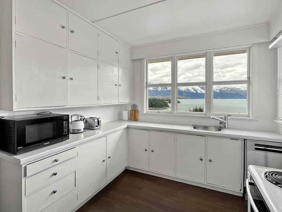 Classic kitchen with views across Lake Wakatipu and the Remarkables