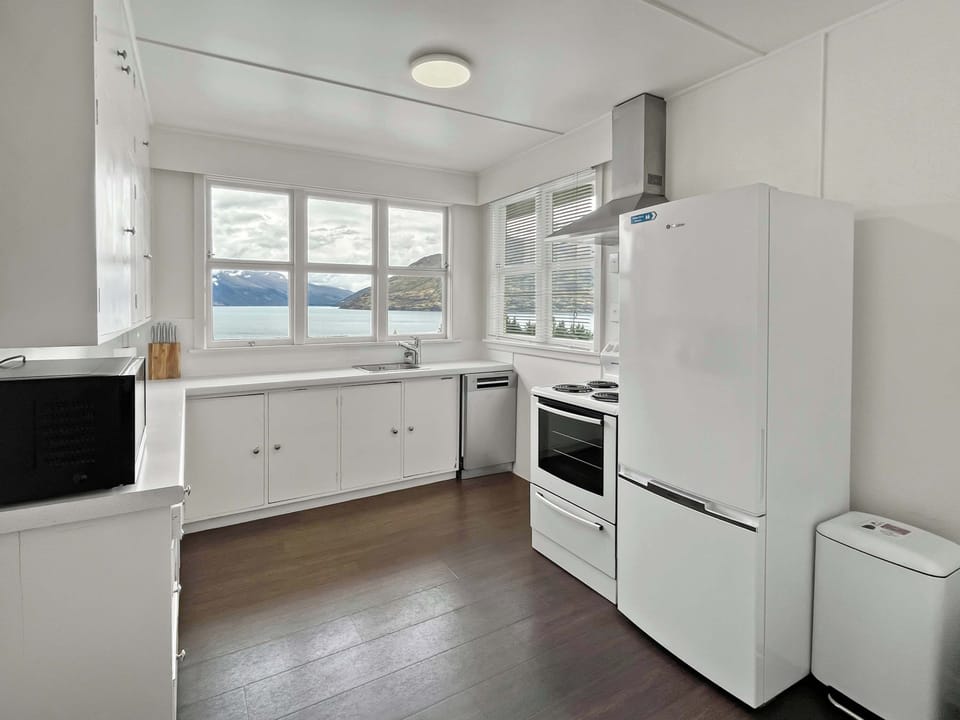 Kitchen with cooking essentials and lake outlook