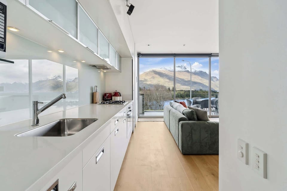 Sleek kitchen design with stunning mountain backdrop