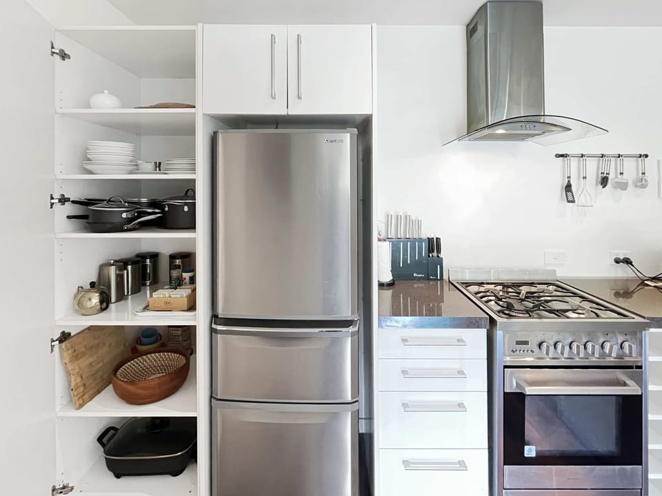 Well-equipped kitchen with gas cooktop and storage