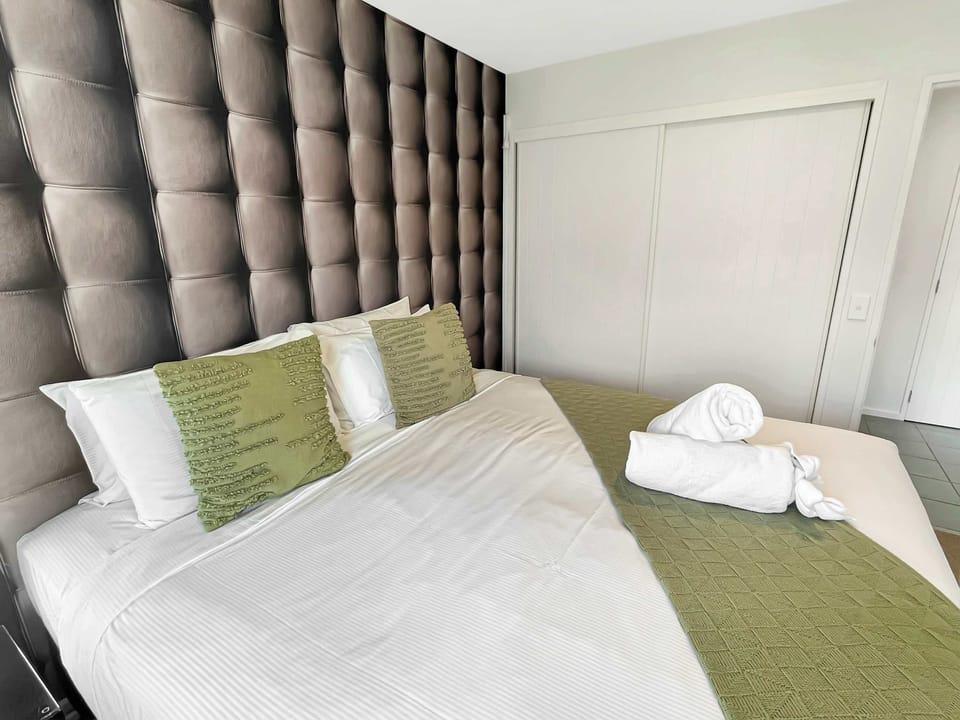 Comfortable guest bedroom with built-in wardrobes