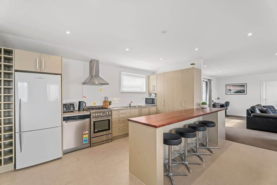 Light filled kitchen flowing seamlessly into the living area for easy socialising.
