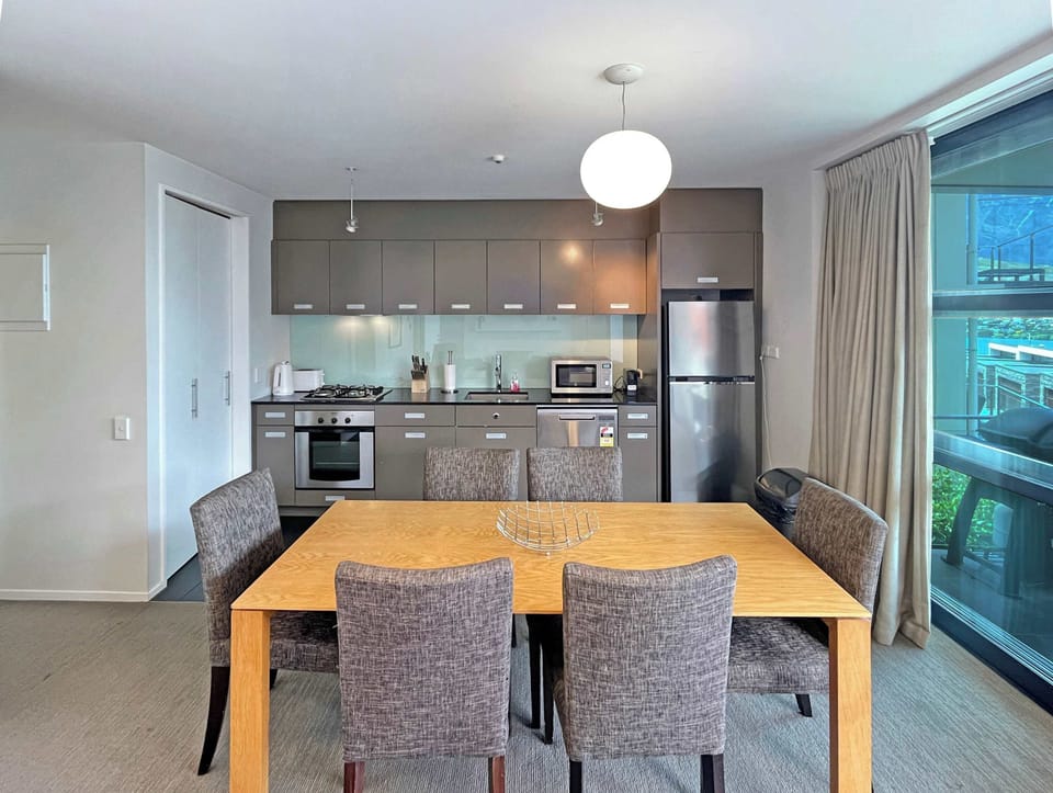 Open-plan living with fireplace and smart TV
