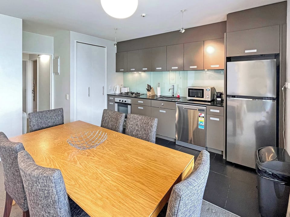 Bright dining space beside the modern kitchen