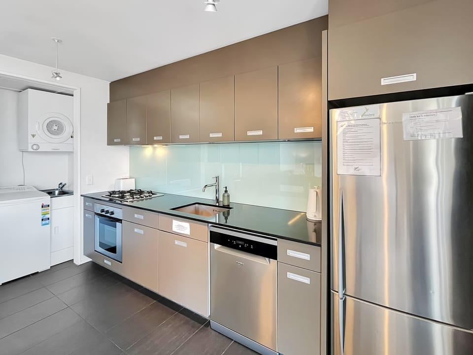 Sleek kitchen with full appliances