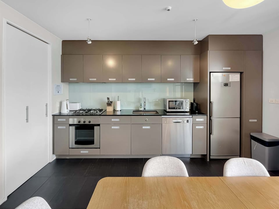 Modern kitchen with full appliances and dining space