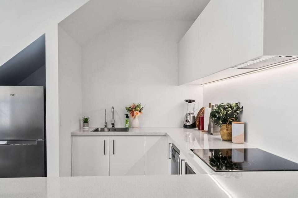 Modern, clean and fresh kitchen featuring all new appliances.