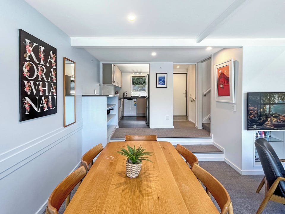 Open plan dining area connecting to kitchen and living space