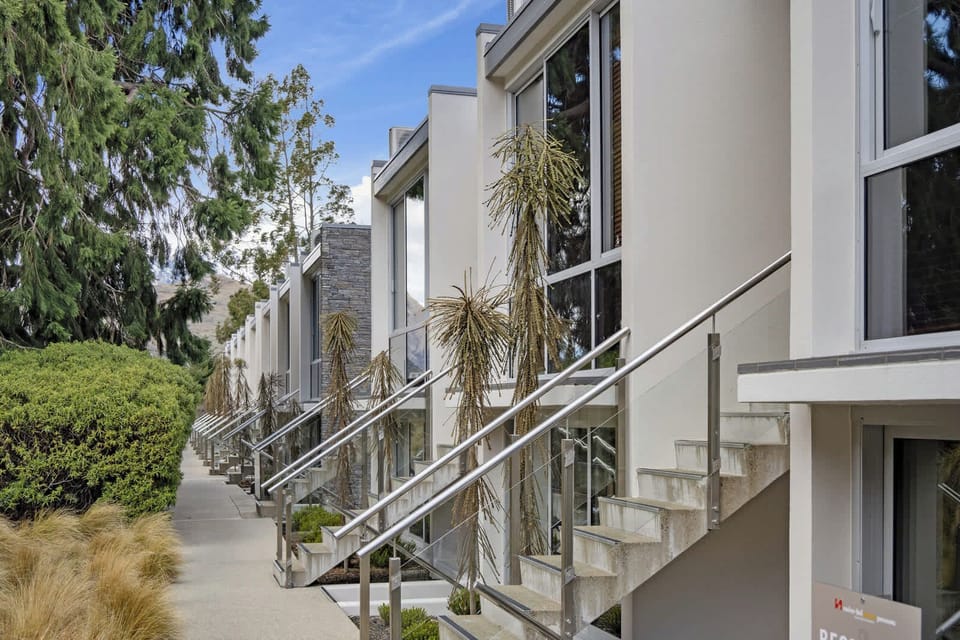 Modern townhouse-style apartment complex.