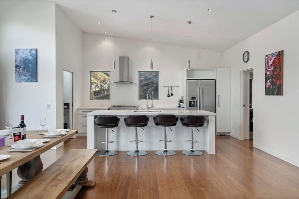 The massive open plan of the dining room and kitchen is perfect for large families or groups of couples or friends.  

Plenty of space for everyone to stretch out.