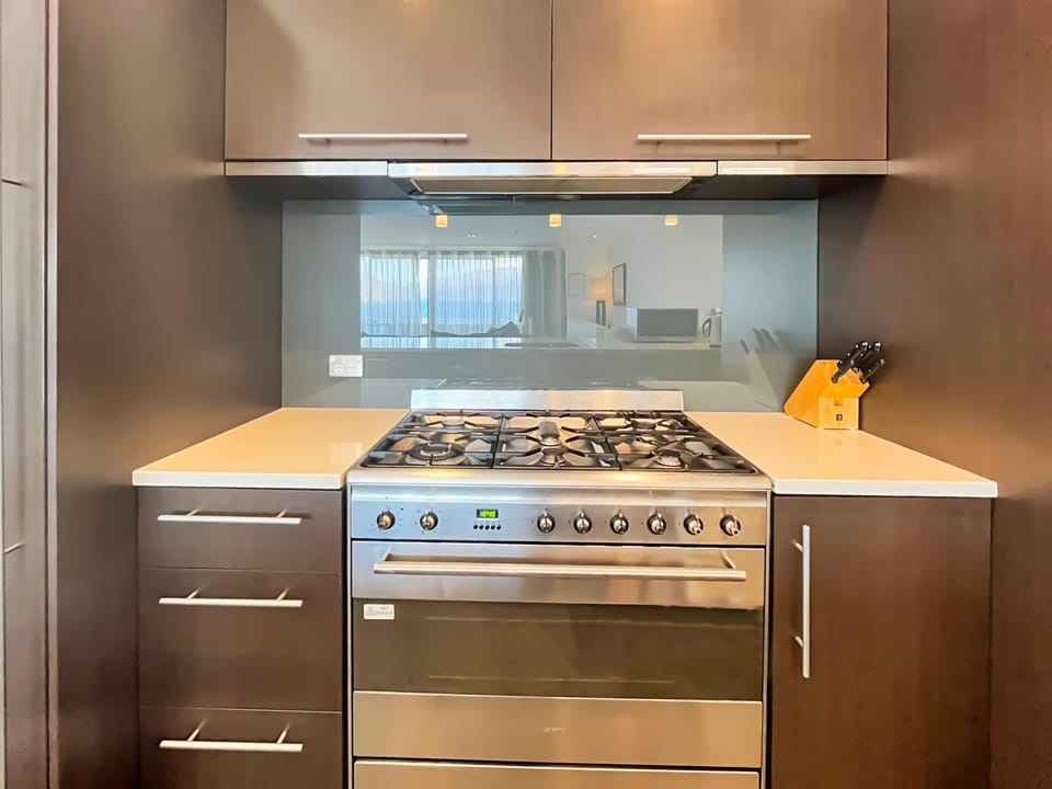 Well equipped kitchen with gas cooktop and modern appliances, ideal for home cooking