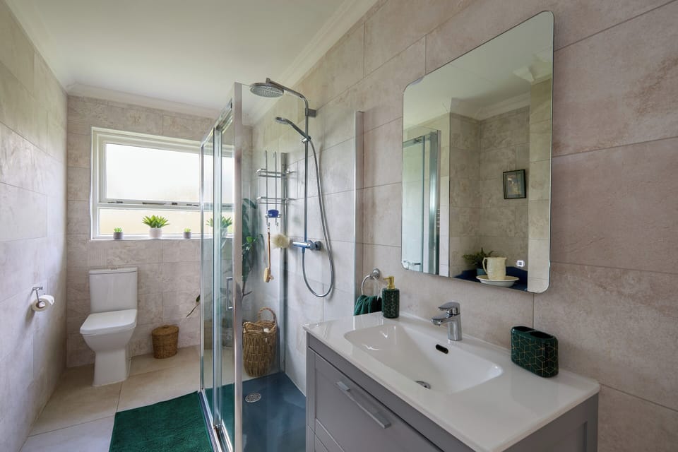 Main hall bathroom with power shower 