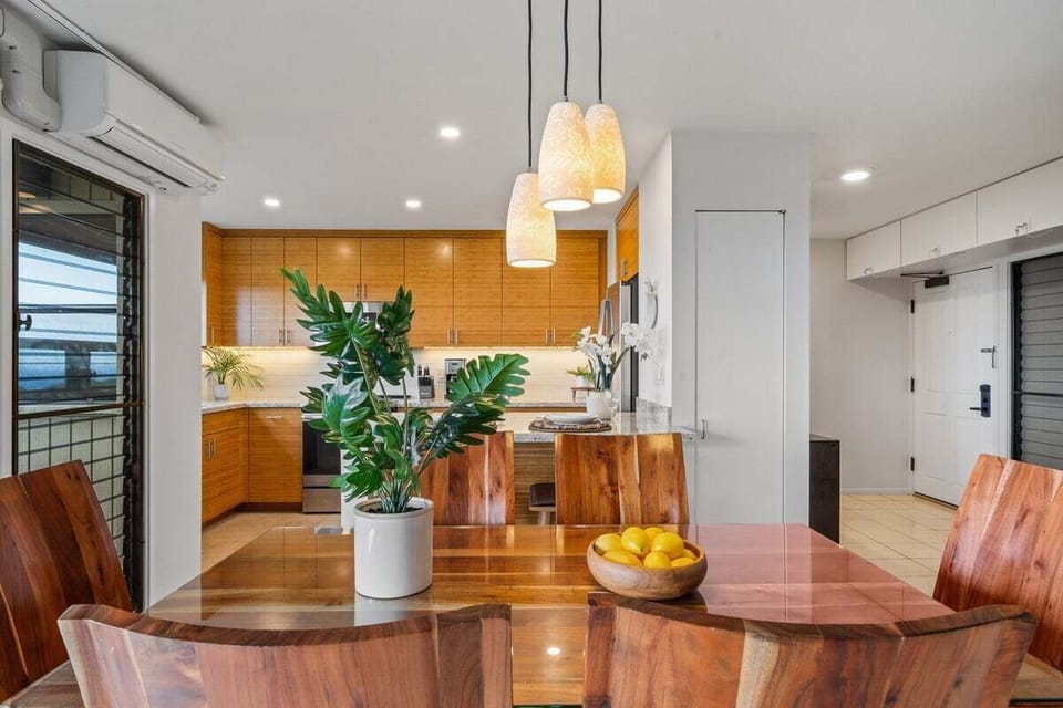 Tables brighten with lemons and plants, kitchens and cabinetry balancing warmth and function.