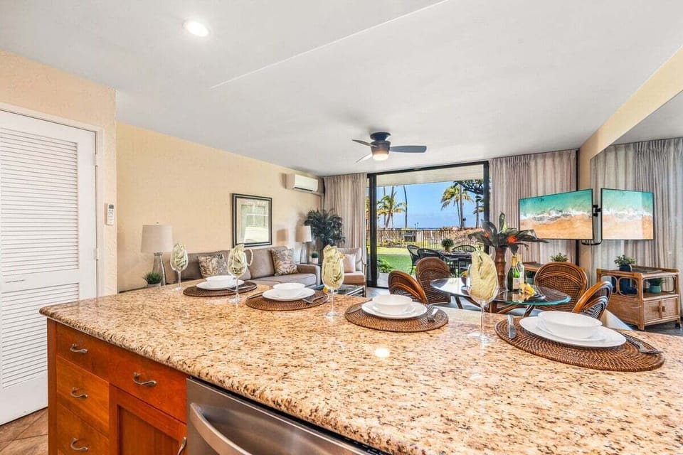 Dine at granite counters set for island evenings and open views.