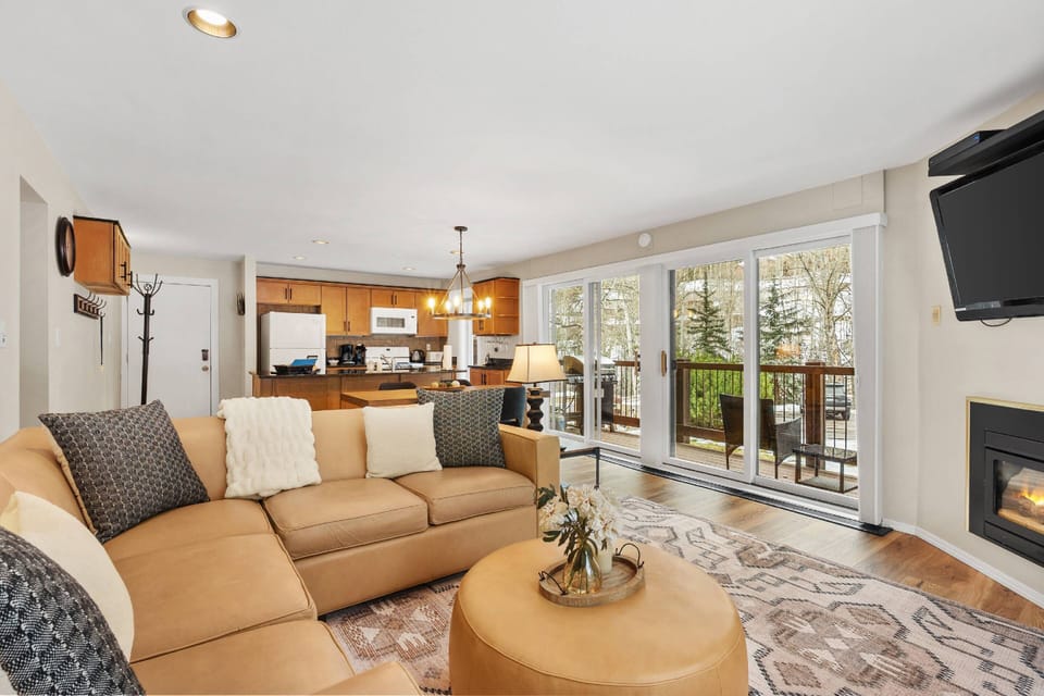 The wall to wall sliding doors provide ample lighting and create a bright and inviting space to relax during your trip to Snowmass