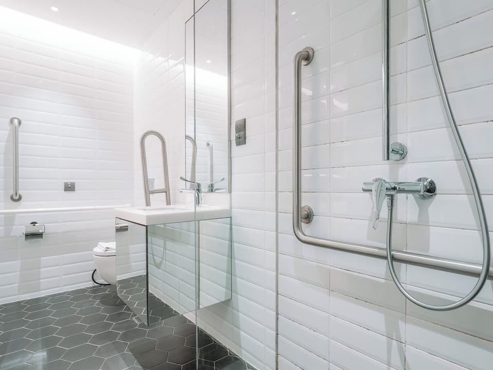 Deluxe Double Room, No Windows | Bathroom | Shower, hair dryer, towels, soap